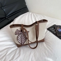 Borsa tote in tela bianco sporco con finiture in pelle marrone e fiocco di seta - Marrone