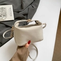 Minimalist beige leather dumpling crossbody bag with adjustable strap for women - Off White