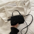 Mini black leopard print crossbody bag with fuzzy texture and top handle on soft fabric - Black