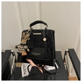 Detail of leopard print flap backpack with gold hardware and a cute bunny charm - With Pendant / Black