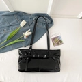Minimalist black glossy leather shoulder bag with decorative straps and silver buckles - Black