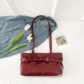 Deep burgundy patent leather underarm tote bag with silver buckle and sleek finish - Red