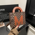 Minimalist coffee brown tote bag with M-letter print and orange leather accent - Brown