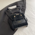 Modischer schwarzer Lederrucksack mit Leopardenmuster-Patchwork und goldenen Metallteilen - Ohne Anhänger / Schwarz