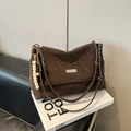 Brown leather shoulder bag with metal chain strap and wooden bead charm on magazine - Coffee With Pendant