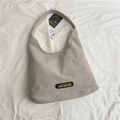 Minimalist grey nylon hobo tote bag with embroidered logo and spacious design - Off White