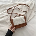Vintage brown crossbody bag featuring white lamb wool flap detail and adjustable strap - Brown