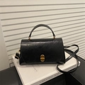 Vintage Handtasche aus schwarzem Öl-Wachs-Leder mit goldenem Drehverschluss und Griff - Schwarz