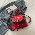 Mini zaino rosso a pois bianchi con decorazioni floreali e volant a scacchi - Rosso