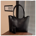 Detail of large black tote bag with fine leather texture and mini snap pouch on strap - Black