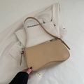 Chic beige matte leather underarm bag with curved flap and adjustable shoulder strap - Khaki