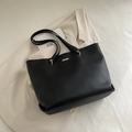 Minimalist black tote bag in matte faux leather with elegant gold hardware detail - Black