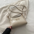 Elegant cream beige bow shoulder bag with gold hardware and slim leather strap - Khaki