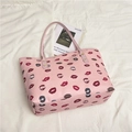 Pink tote bag with trendy lip pattern and gold rivets for casual daily fashion - Pink