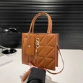 Brown quilted leather tote bag with gold S-logo and fringe tassel for casual use - Brown