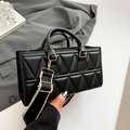 Triangle quilted handbag in black leather with wide striped strap and gold hardware - Black
