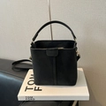 Fashionable black bucket handbag in matte finish with gold hardware and top handle - No Pendant / Black