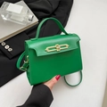 Elegant bright green leather handbag with gold metal clasp and top handle for women - Green