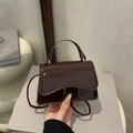 Brown patent leather shoulder bag with top handle and sleek crossbody strap for women - Brown