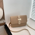 Chic khaki woven crossbody bag with gold buckle on a minimalist display surface - Khaki