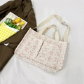 Corduroy tote bag in cream with pink bow patterns and dual front pockets - Bow Off White