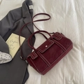 Elegant burgundy leather handbag with white stitching and adjustable strap - Burgundy