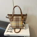 Retro brown plaid wool tote bag with leather handles and decorative beads on display - Khaki Plaid With Charm