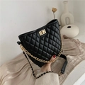 Elegant black quilted bucket bag with golden chain strap and classic twist lock buckle - Black