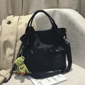 Black canvas tote bag with sport label and green dinosaur plush pendant charm - Black (Dinosaur Charm)