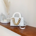 White quilted faux leather crossbody bag with bold gold chain and top handle - White