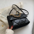 Black quilted crossbody bag with chunky gold chain handle and leather shoulder strap - Black
