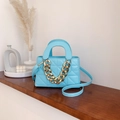 Light blue quilted shoulder bag with decorative chunky gold chain strap and top handles - Blue