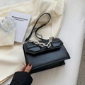 Black leather crossbody bag with geometric relief and thick silver chain handle - Black