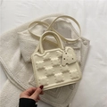 Creamy white small square biscuit bag with textured pattern and top handle - Off White