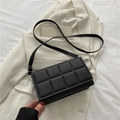 Black matte leather crossbody bag featuring a chic checkered quilted pattern design - Black