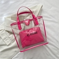 Transparent PVC tote bag featuring a magenta inner pouch and matching leather handles - Transparent Pink