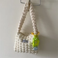 Off-white bubble textured shoulder bag with floral charm and Fashion Instinct label - With Charm / White
