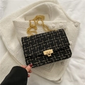 Classic black and white tweed crossbody bag with golden chain strap and lock closure - Black