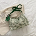 Green and beige woven hobo bag with matching leather strap and flower charm detail - Green with Charm