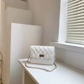 Elegant white quilted chain crossbody bag with gold hardware and rhombic stitching detail - Off-white