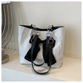 Detail of white pleated tote bag with large black velvet bow and silver chain strap - White