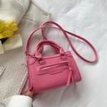 Chic magenta mini crossbody bag with motorcycle style zips and long tassels - Pink
