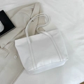 Chic white quilted tote bag with large capacity and elegant embossed triangle stitching - White