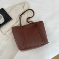 Dark brown tote bag featuring geometric triangle quilting and large capacity design - Red Brown