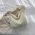 Chic off-white quilted cloud shoulder bag featuring oversized diamond stitching design - Off White