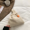 Creamy white corduroy knot tote bag with orange carrot charm and soft ribbed texture - White