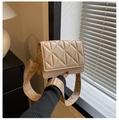 Detail of beige quilted square crossbody bag featuring wide jacquard shoulder strap - Khaki
