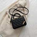 Fashionable black quilted PU crossbody bag with woven top handle and gold hardware detail - Black