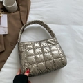 Elegant champagne gold quilted puffer handbag with a glossy metallic finish for women - Gunmetal