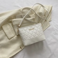 Minimalist white quilted shoulder bag with gold metal trim and smooth leather panel - White
